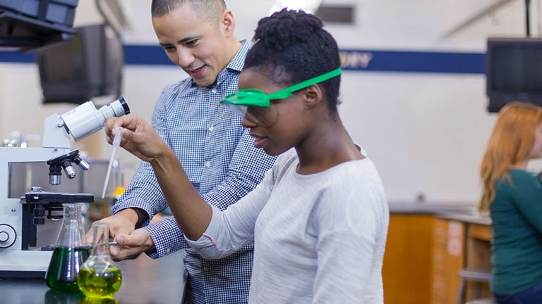 Students studying science and chemistry in a laboratory